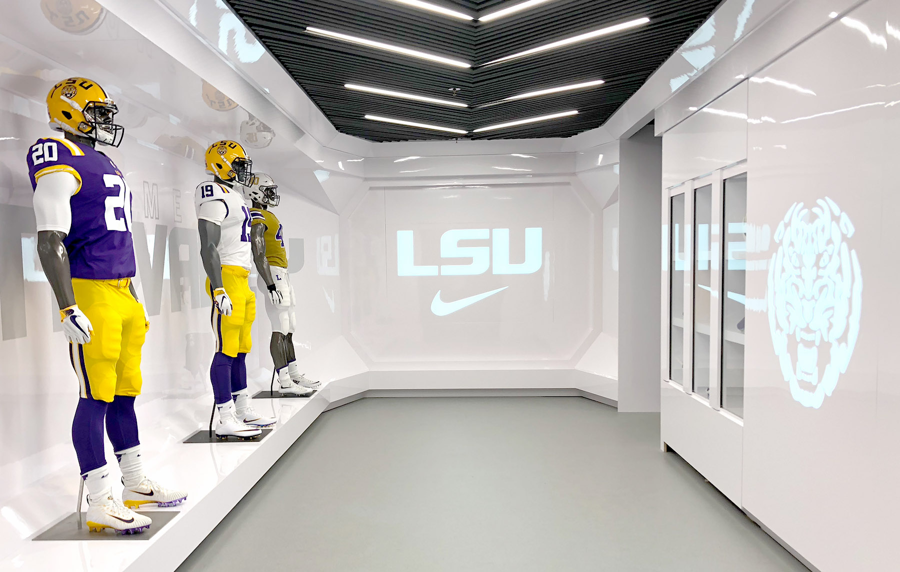 LSU football uniforms from previous years on display at LSU Football Operations Center